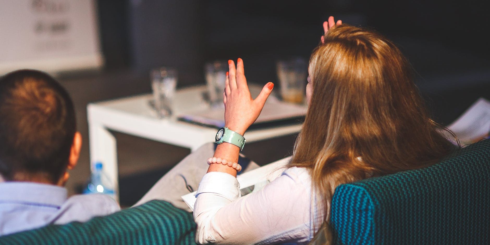 hands-people-woman-meeting behind of woman gesturing