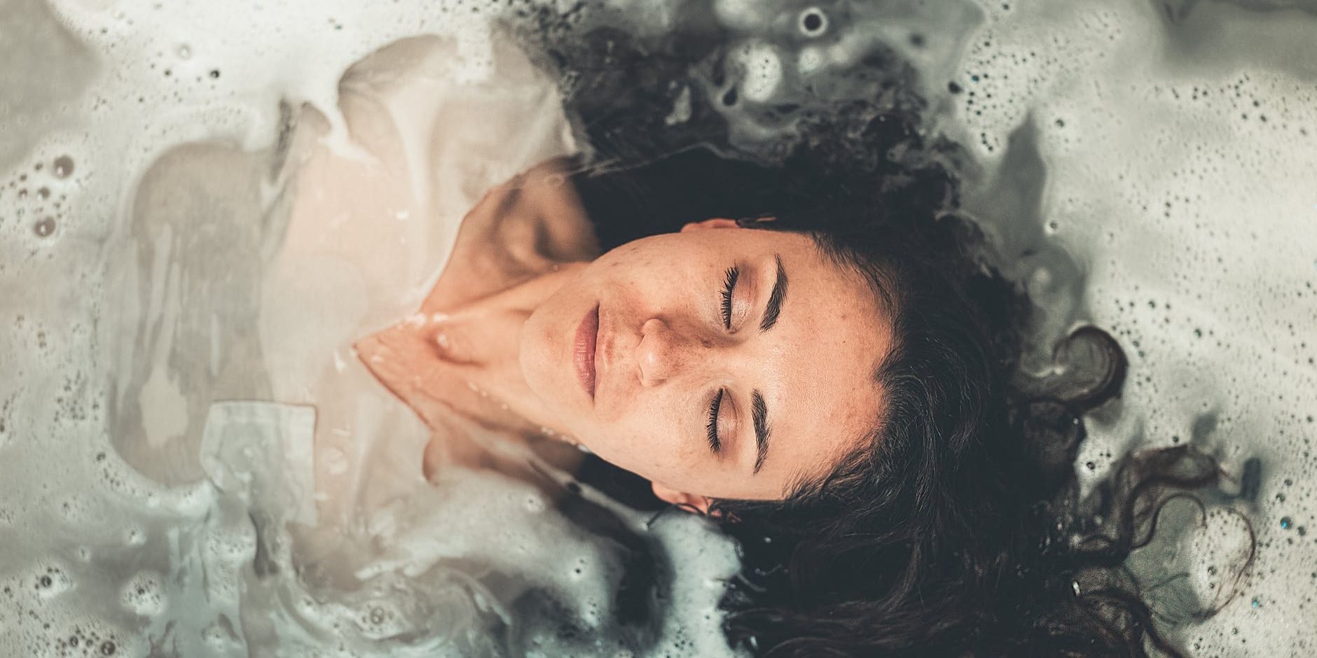 woman in white dress in bath tub