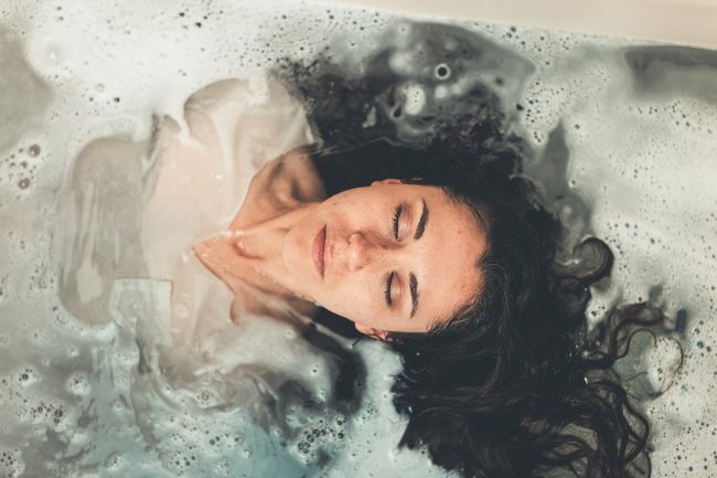 pexels-photo-2306203 woman in white dress in bath tub
