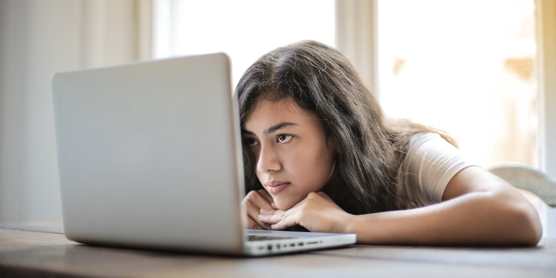 pexels-photo-3807747 young woman using laptop at home